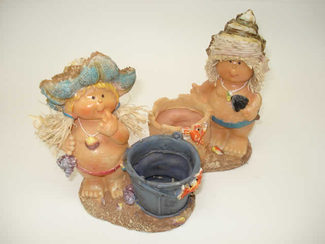 RESINA DECORACION COLECCIÓN MUÑECA NIÑA EN LA PLAYA